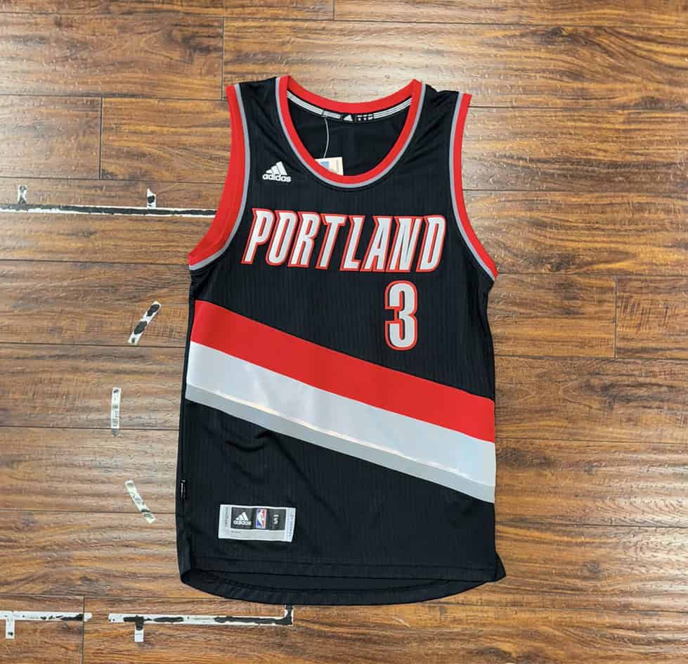 Front view of black CJ McCollum Portland Trail Blazers Swingman jersey, featuring the number 3.